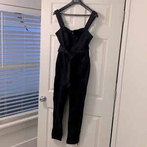 Black stretchy overalls/jumpsuit.